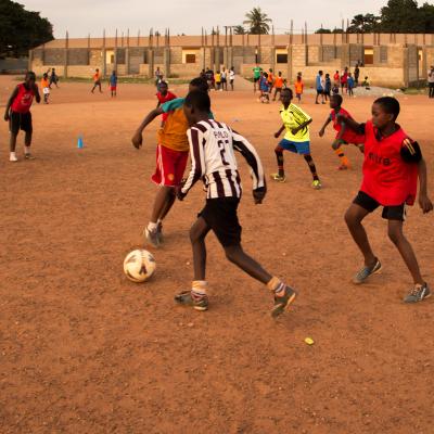 A Projects Abroad volunteer work with teens to teach football in Ghana. A sports player gains experience through volunteer football coaching in Ghana.
